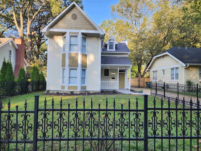 425 S Reese St S, Memphis, TN 38111 - victorian-style house with a front lawn, a porch, and a fenced front yard