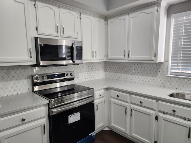 425 S Reese St S, Memphis, TN 38111 - kitchen with white cabinets and appliances with stainless steel finishes