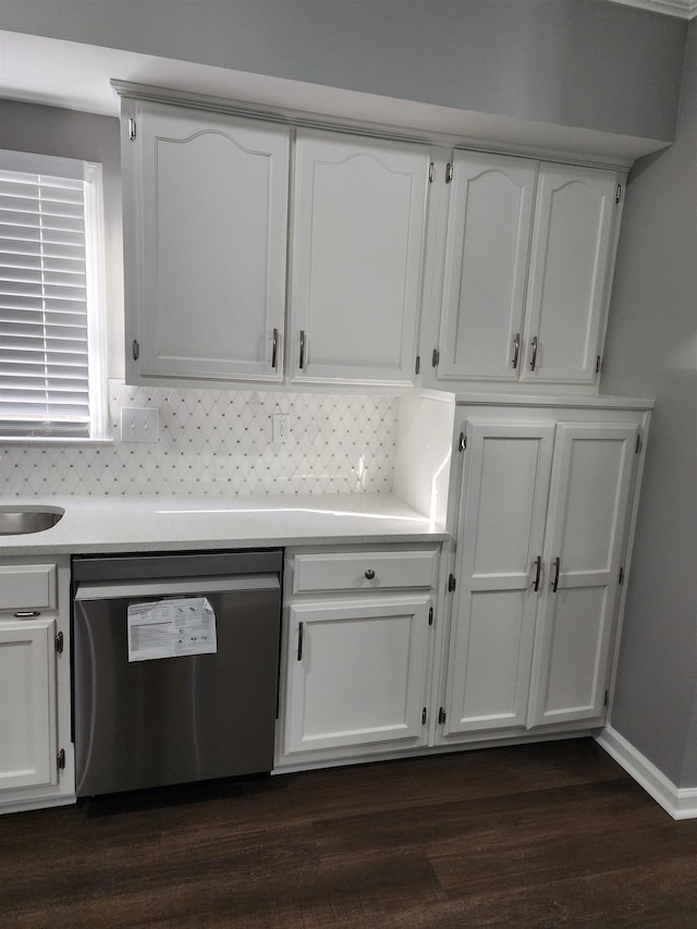425 S Reese St S, Memphis, TN 38111 - kitchen with stainless steel dishwasher, dark wood-style floors, white cabinetry, decorative backsplash, and light countertops