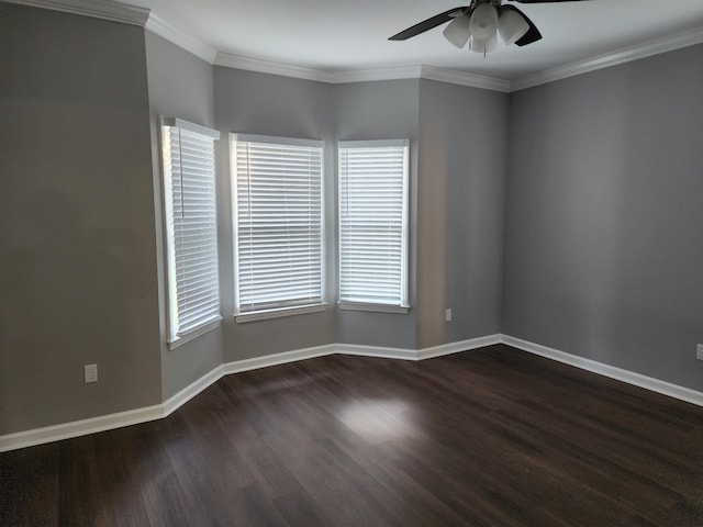 spare room with ornamental molding, ceiling fan, and dark wood-type flooring