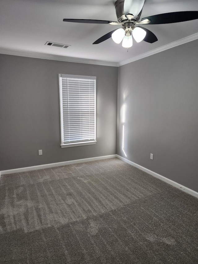 carpeted empty room featuring ceiling fan and ornamental molding