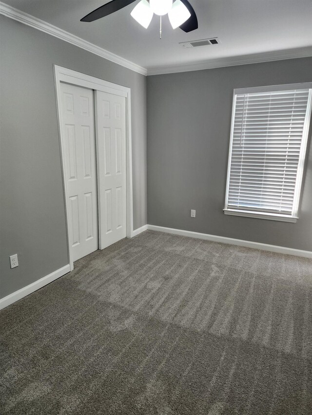 425 S Reese St S, Memphis, TN 38111 - unfurnished bedroom featuring crown molding, a closet, carpet, baseboards, and visible vents