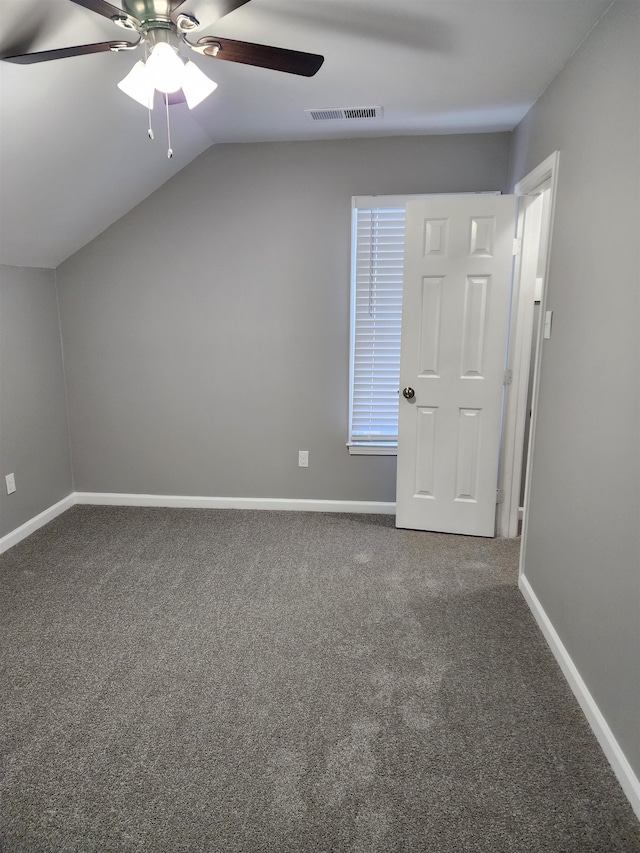 additional living space featuring lofted ceiling, ceiling fan, and carpet