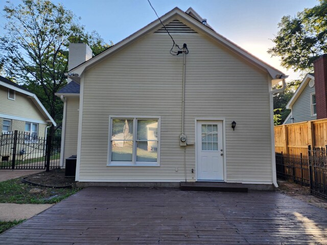 425 S Reese St S, Memphis, TN 38111 - rear view of property featuring a wooden deck, central AC, a chimney, and fence