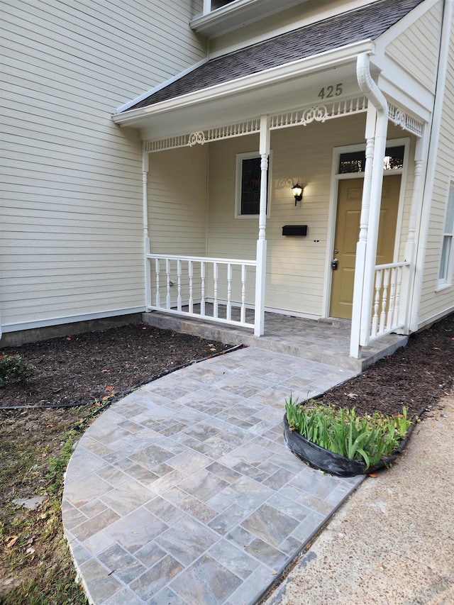 doorway to property featuring covered porch