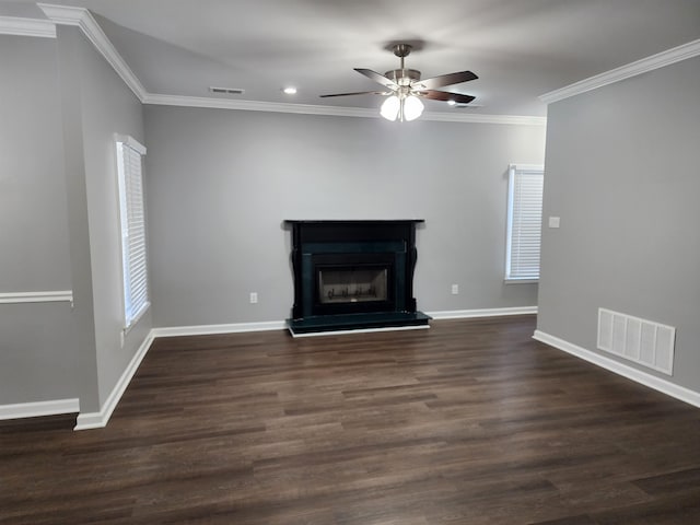 unfurnished living room with dark hardwood / wood-style floors, ornamental molding, and ceiling fan