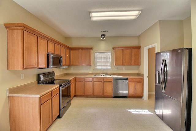 kitchen featuring appliances with stainless steel finishes and sink