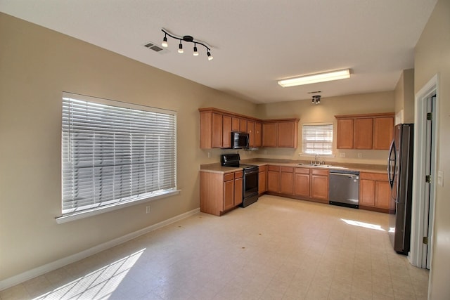 kitchen featuring stainless steel appliances and sink