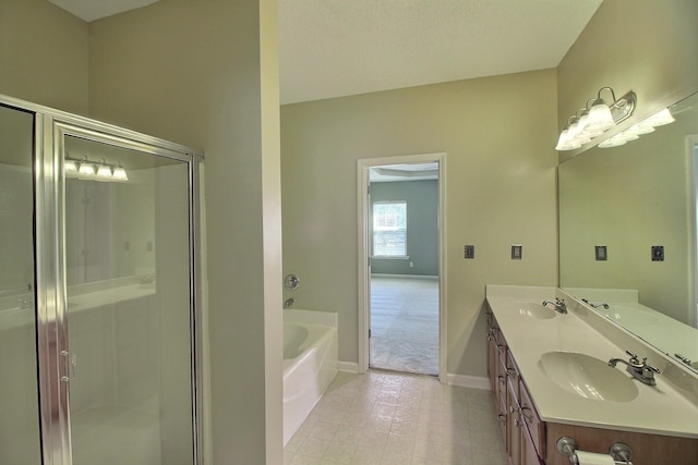 bathroom with separate shower and tub and vanity