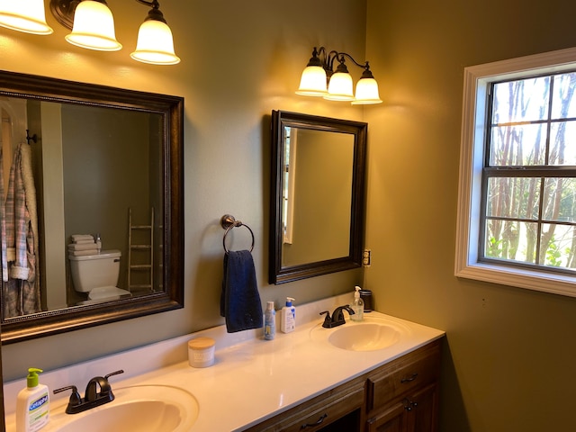 bathroom with vanity and toilet