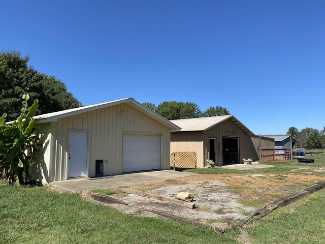 2845 Gilchrist Stantonville Rd, Stantonville, TN 38379 - view of front of property featuring fence, an outdoor structure, and a detached garage