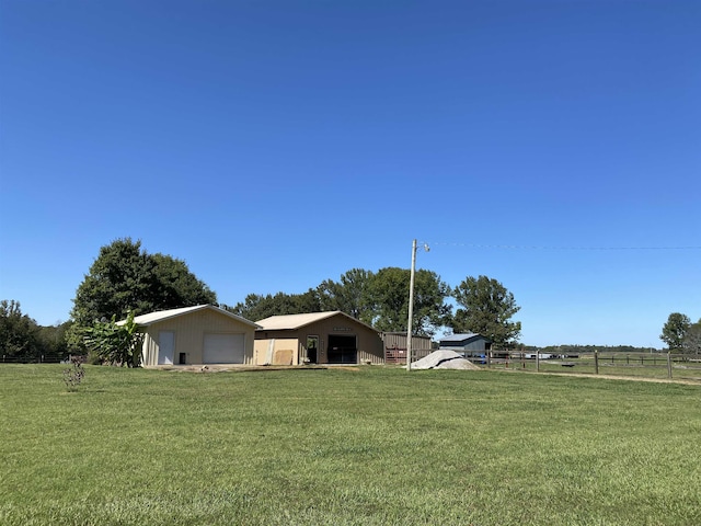 2845 Gilchrist Stantonville Rd, Stantonville, TN 38379 - view of yard with fence, an outbuilding, a pole building, and a detached garage