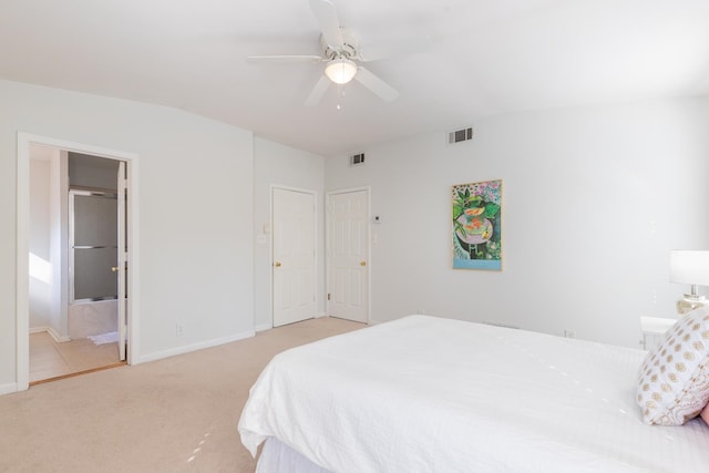 carpeted bedroom featuring ensuite bathroom and ceiling fan