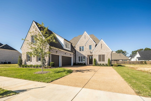 view of front facade featuring a garage and a front lawn