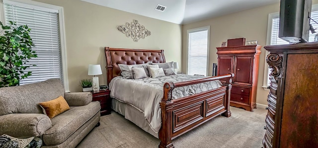 bedroom featuring light carpet