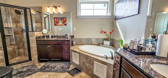 bathroom with vanity, shower with separate bathtub, and tile patterned floors