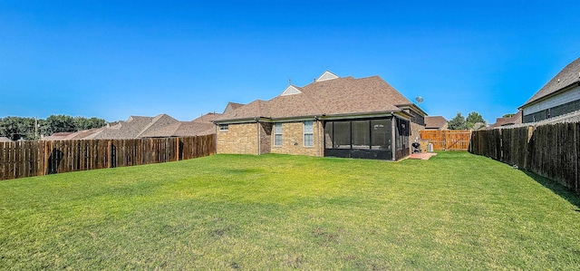 view of yard featuring a sunroom