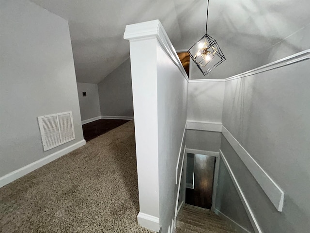 stairs with carpet flooring and vaulted ceiling