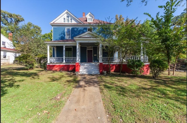 1072 N Highland Ave, Jackson, TN 38301 - view of front of property with a front yard and covered porch