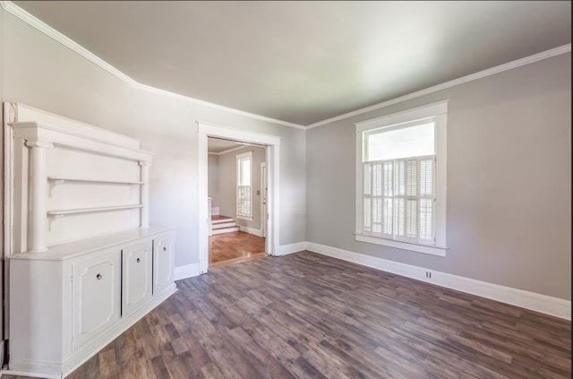 unfurnished room featuring dark hardwood / wood-style floors and crown molding