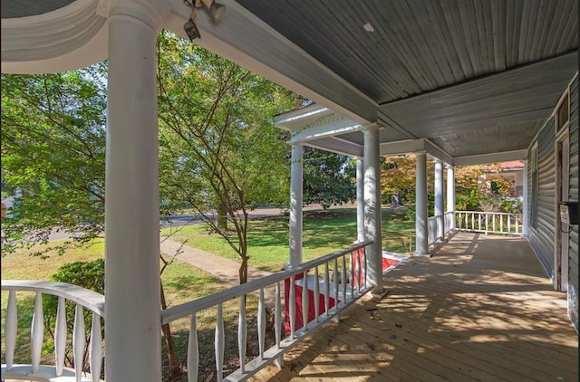 wooden terrace with a porch