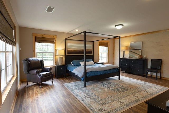 bedroom with hardwood / wood-style flooring