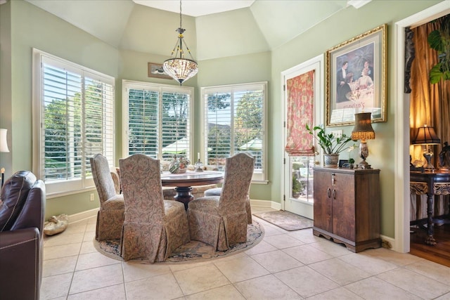 dining space featuring vaulted ceiling and a wealth of natural light