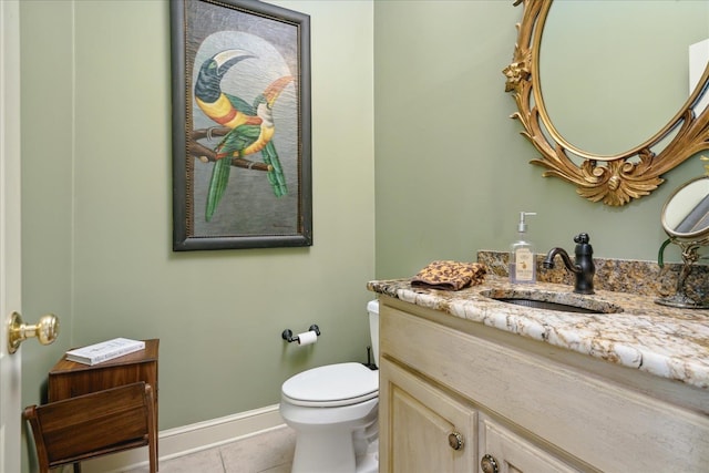 bathroom with tile patterned floors, vanity, and toilet