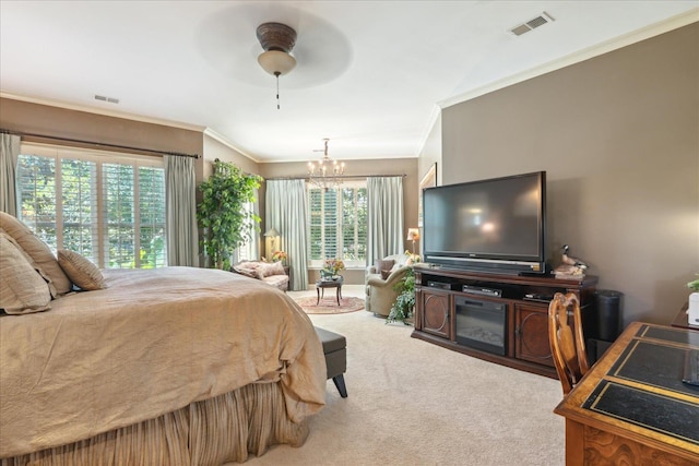 carpeted bedroom with ceiling fan with notable chandelier, ornamental molding, and multiple windows