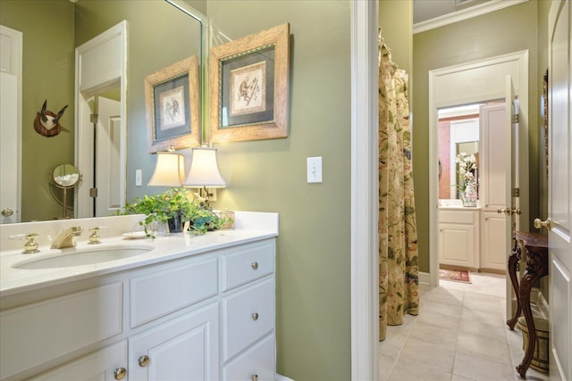 bathroom featuring curtained shower, ornamental molding, tile patterned floors, and vanity