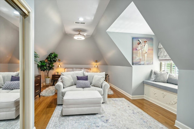 interior space with lofted ceiling and light hardwood / wood-style flooring