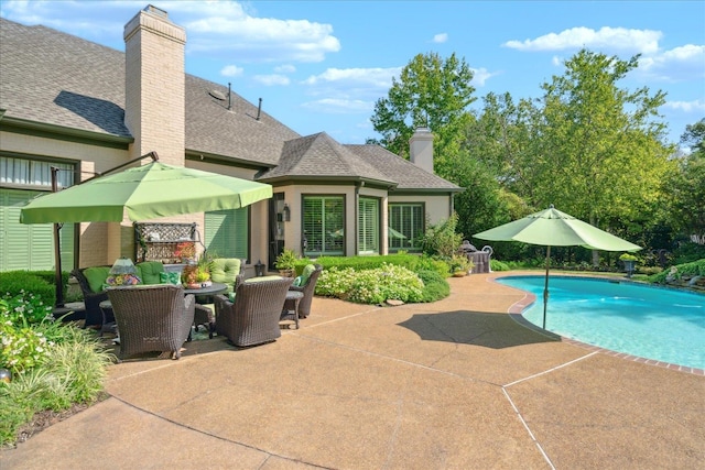 view of pool featuring a patio