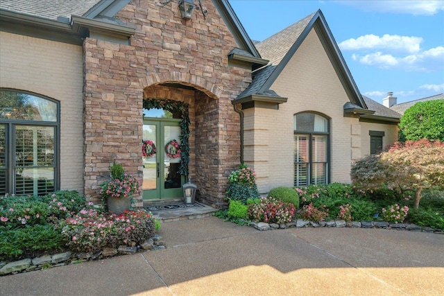 view of exterior entry featuring french doors