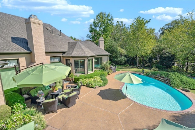 view of pool featuring a patio area