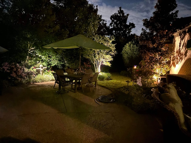 view of patio terrace at dusk