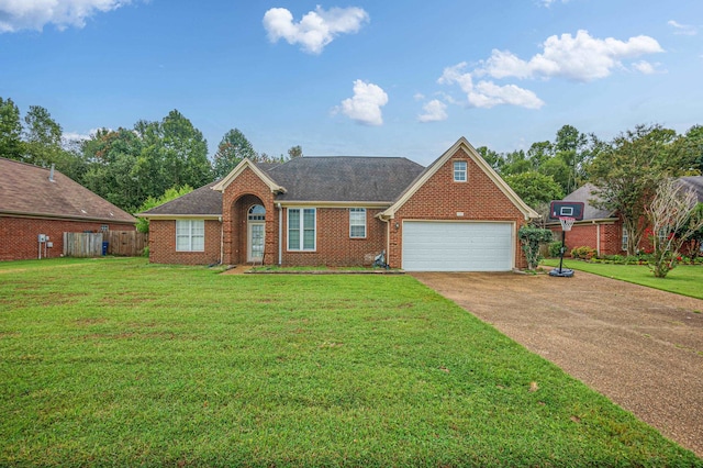 view of front of house featuring a garage and a front lawn