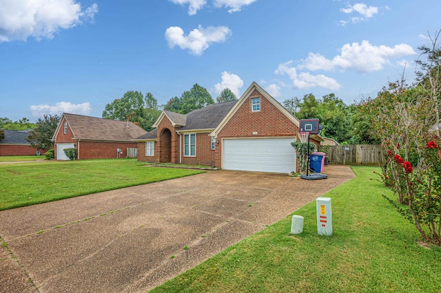 view of front of house featuring a front yard and a garage