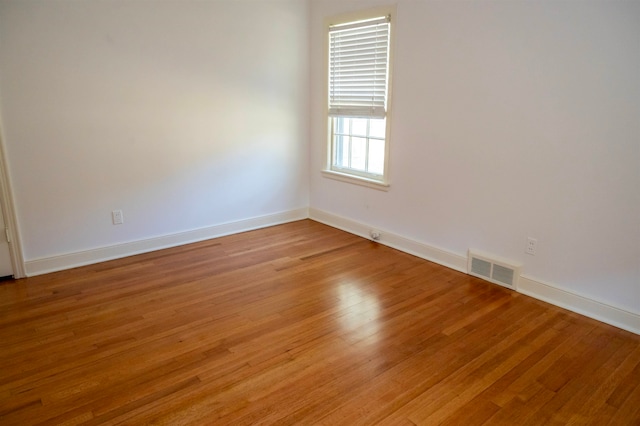 spare room featuring light hardwood / wood-style flooring