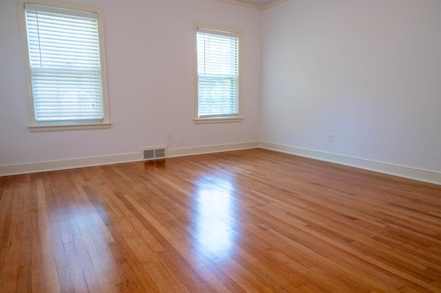 empty room with light hardwood / wood-style floors