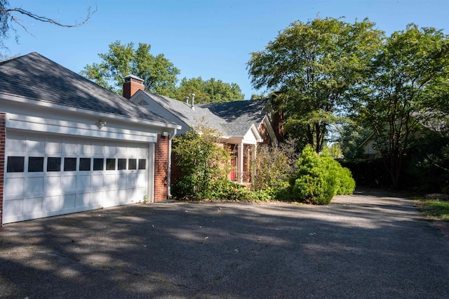 view of side of property featuring a garage