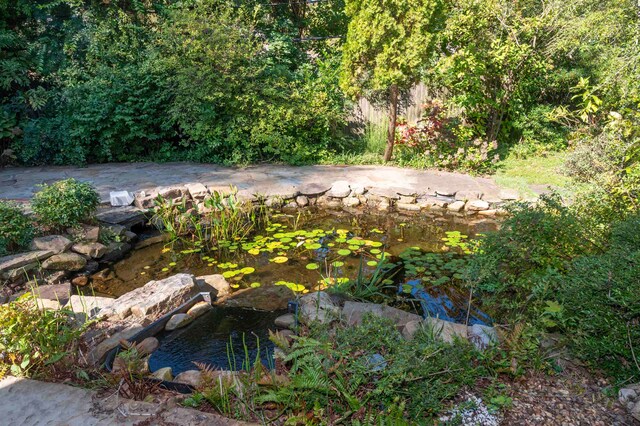 exterior space featuring a small pond