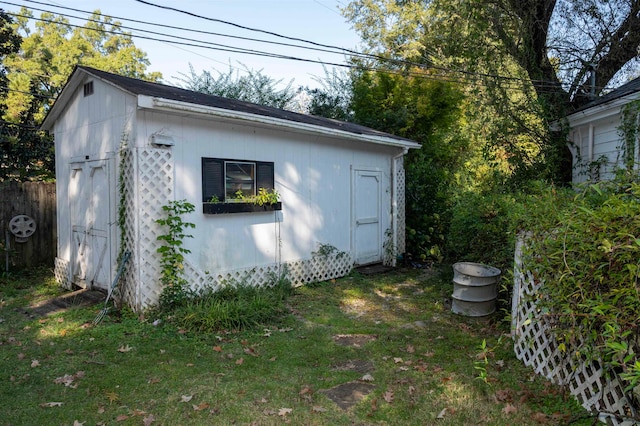 view of outbuilding featuring a lawn