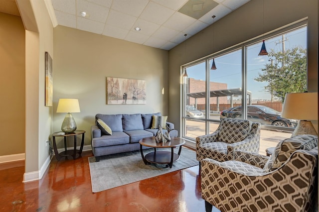 21 Mina Ave Unit 207, Memphis, TN 38103 - living room featuring baseboards, a drop ceiling, concrete floors, and recessed lighting