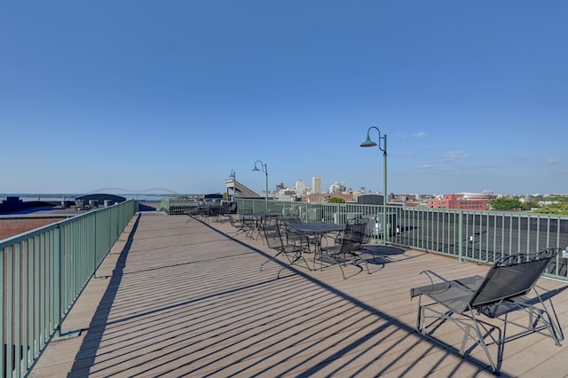 21 Mina Ave Unit 207, Memphis, TN 38103 - wooden terrace with outdoor dining space