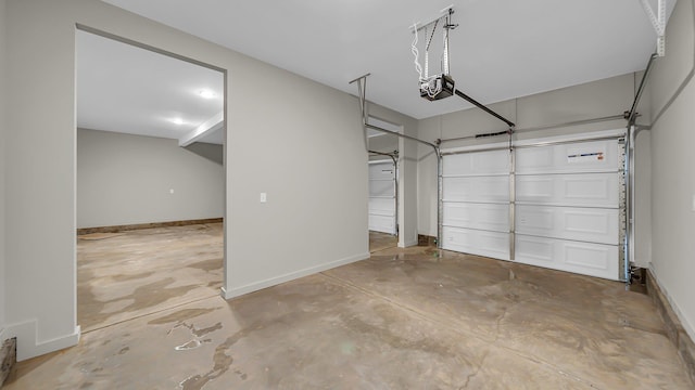 garage with baseboards and a garage door opener