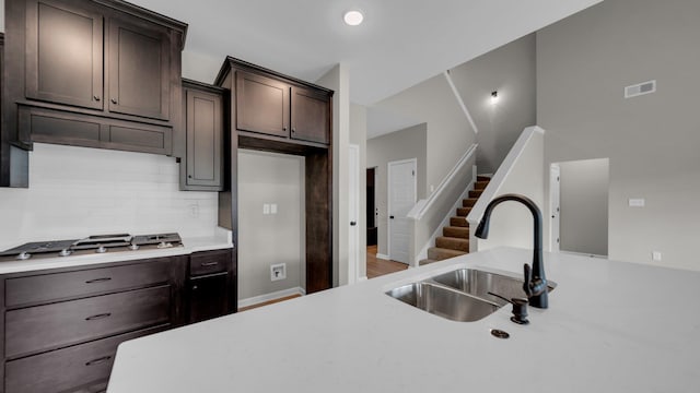 kitchen featuring light countertops, a sink, and visible vents