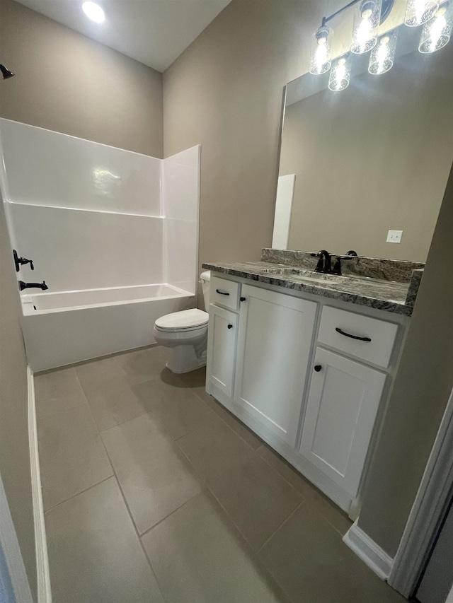 bathroom featuring tile patterned floors, vanity, and toilet