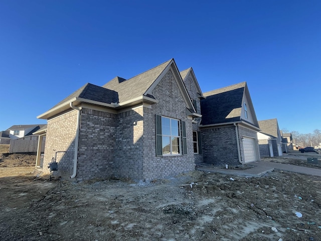 view of side of property featuring a garage