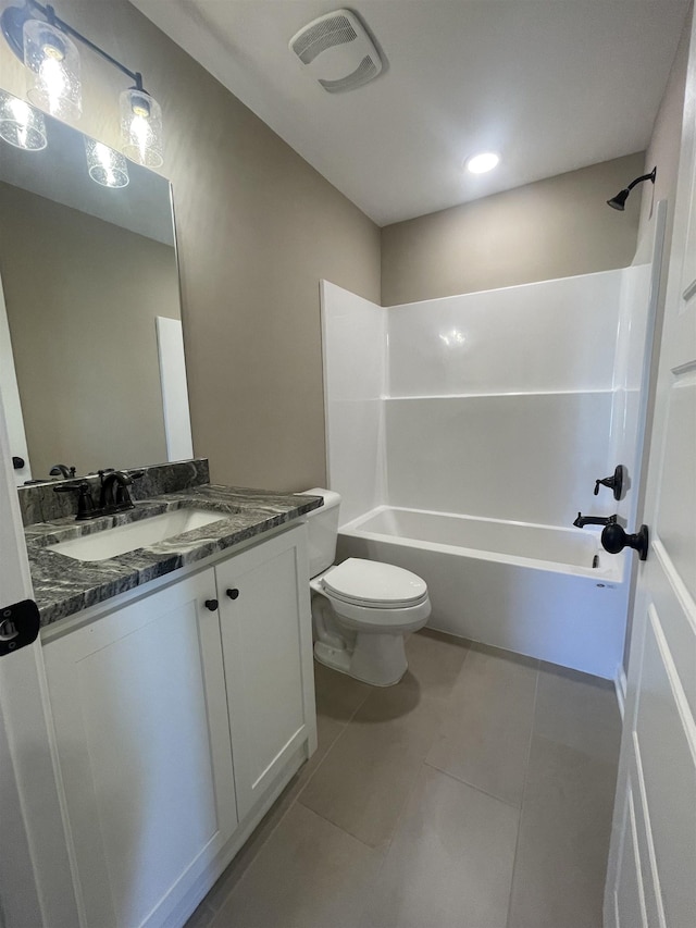 full bathroom featuring vanity, tile patterned floors,  shower combination, and toilet