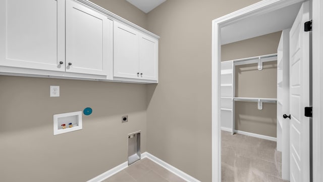 laundry room featuring cabinets, washer hookup, light carpet, and electric dryer hookup